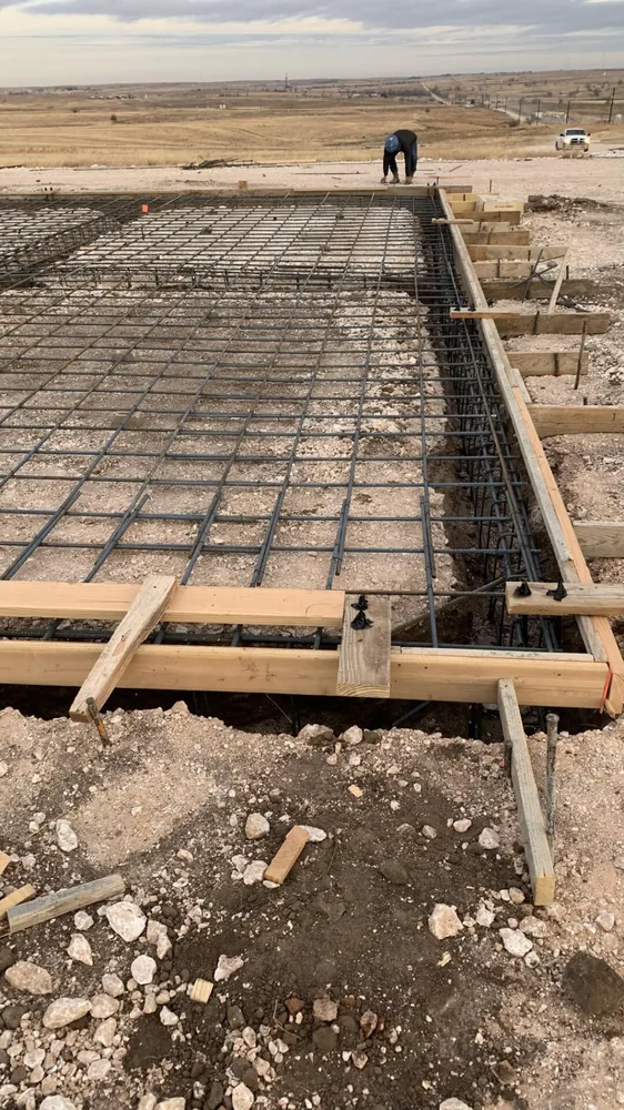 Rebar grid tied inside timber forms and ready for a foundation pour